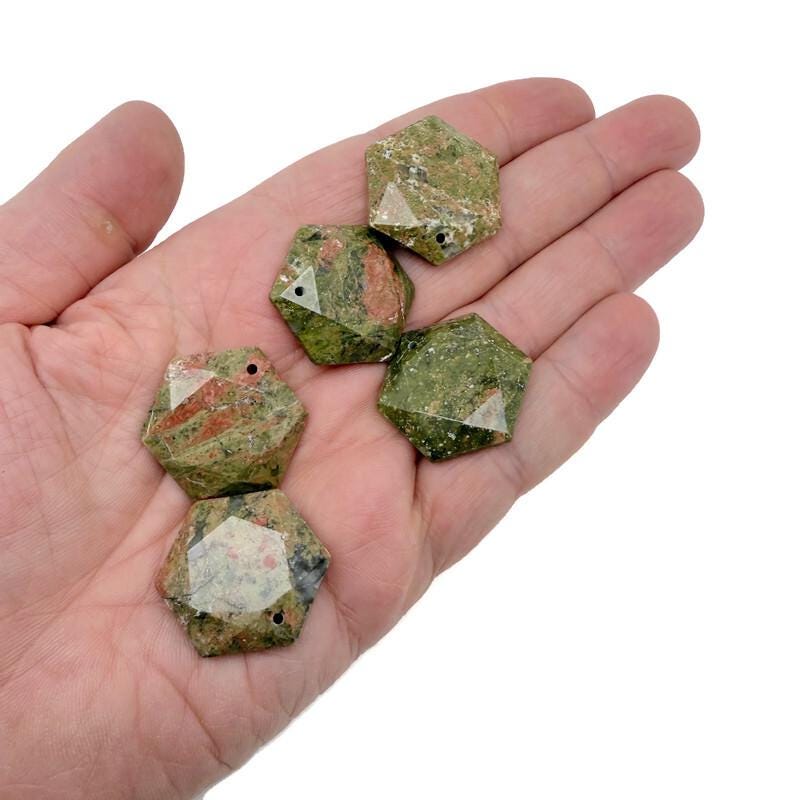 Faceted Unakite hexagon crystal pendant necklace with a polished stone bead, showcasing its green and pink earthy tones.