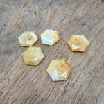 Yellow jade hexagon crystal pendant necklace with faceted stone bead from GemstoneGO, showcasing the vibrant yellow gemstone.