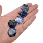 Faceted sodalite hexagon crystal pendant necklace with a gemstone bead, showcasing a deep blue and white veined stone.