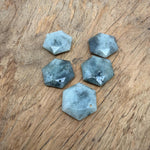 Faceted Labradorite hexagon crystal pendant necklace with natural gemstone bead on a chain, showcasing iridescent blue and green hues.