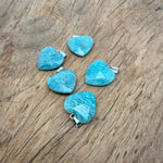 Faceted Amazonite heart crystal pendant from GemstoneGO, showcasing a natural blue-green gemstone with a silver bail.