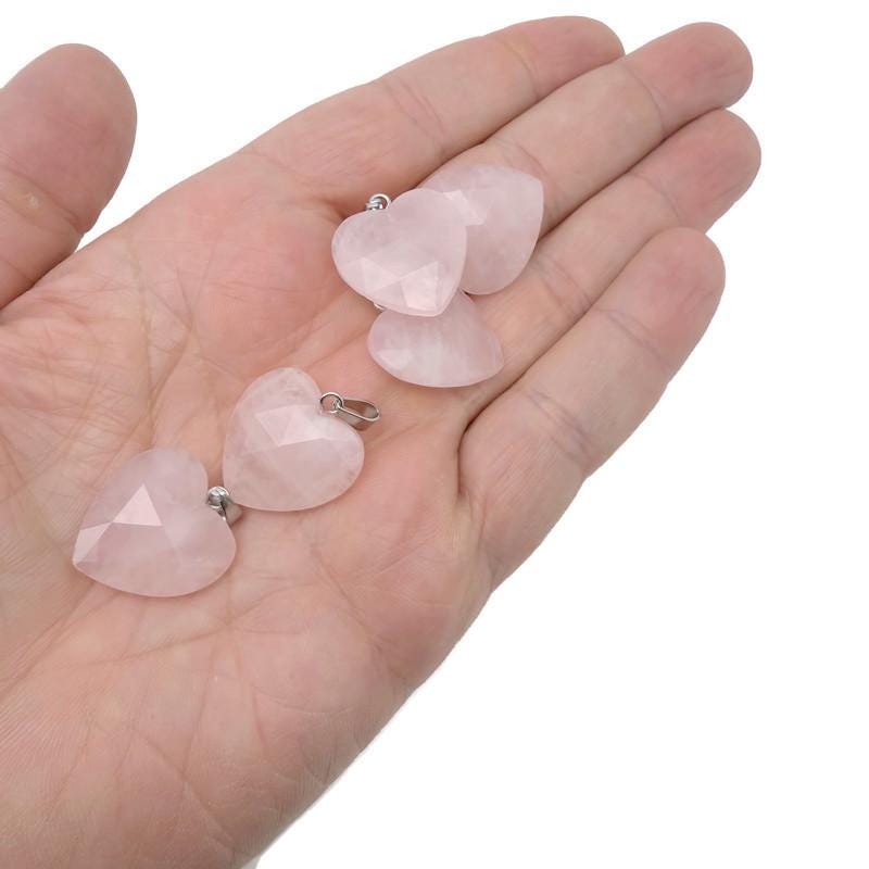 Faceted rose quartz heart crystal pendant from GemstoneGO, natural gemstone charm with a polished, heart-shaped design