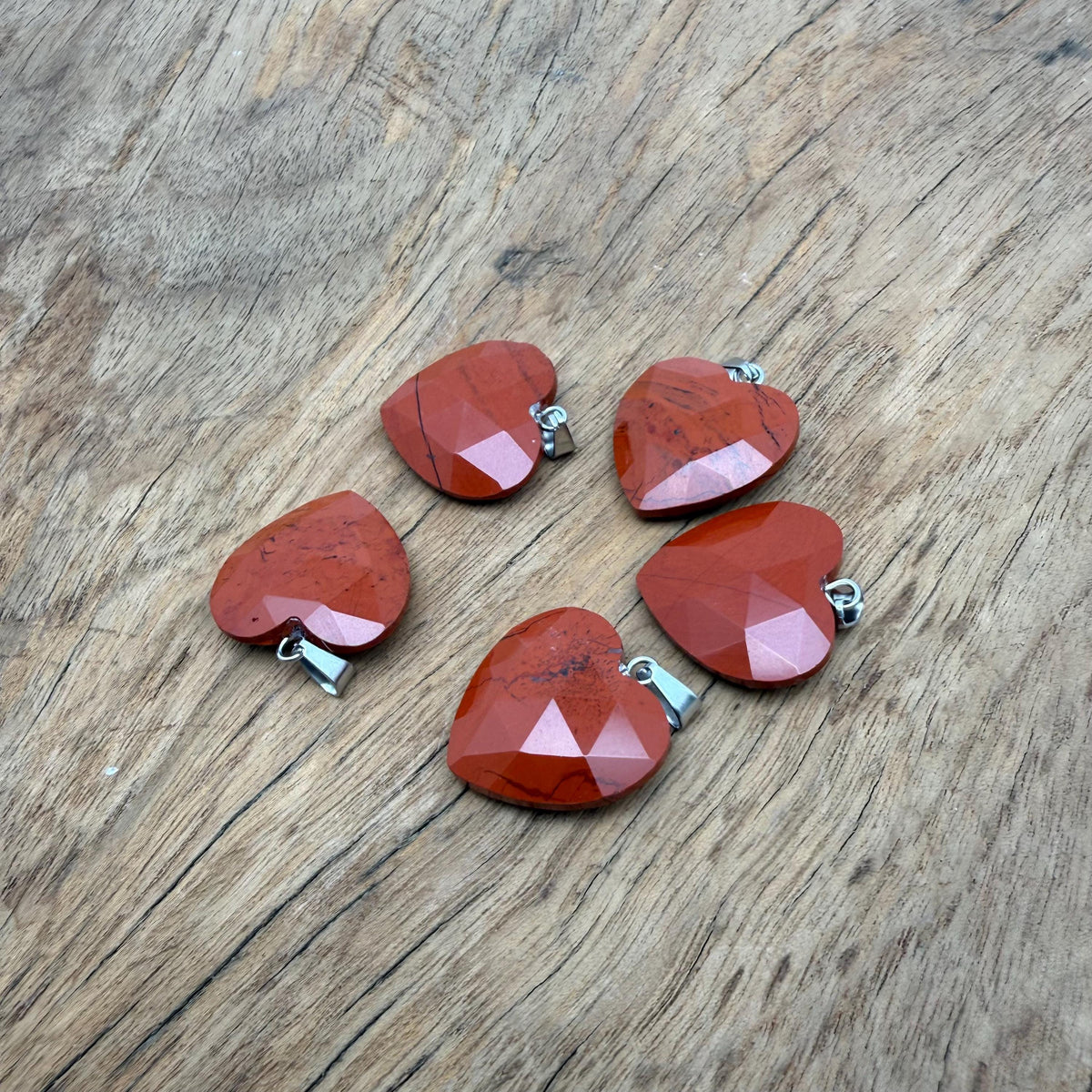 Red Jasper faceted heart crystal pendant by GemstoneGO, showcasing a polished natural red jasper heart charm with a gemstone loop.