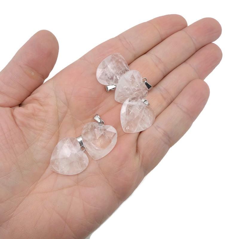 Faceted clear quartz heart crystal pendant from GemstoneGO showcasing a natural gemstone charm with intricate faceting.