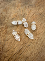 Clear quartz double terminated crystal pendant from GemstoneGO featuring a natural gemstone point with polished surfaces.