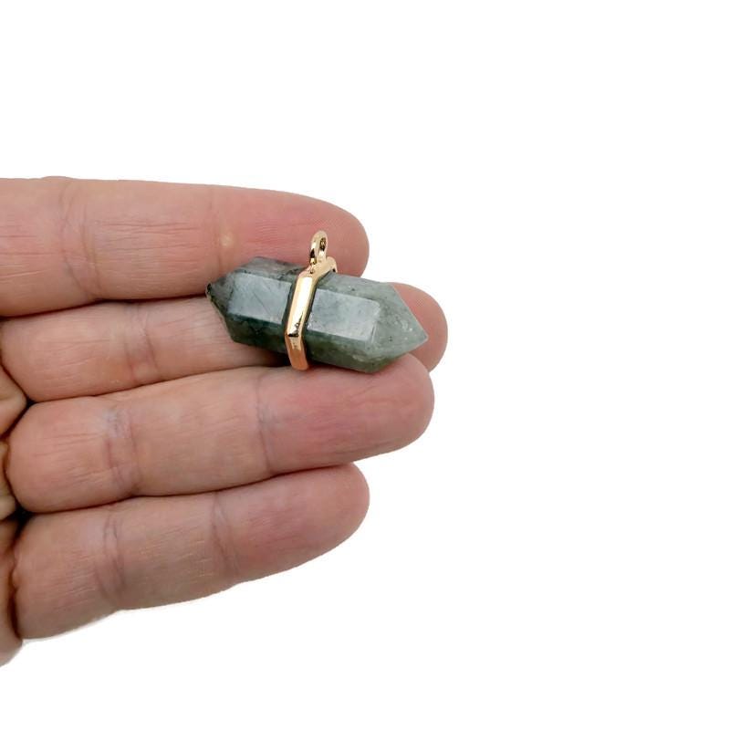 Labradorite double terminated crystal pendant with natural gemstone point, showcasing iridescent blue and green hues on a silver chain.