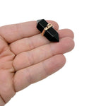 Natural obsidian double terminated crystal pendant from GemstoneGO featuring a pointed gemstone with black, glossy surface.