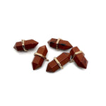 Red Jasper double terminated crystal pendant from GemstoneGO, featuring a natural gemstone point on a simple cord.