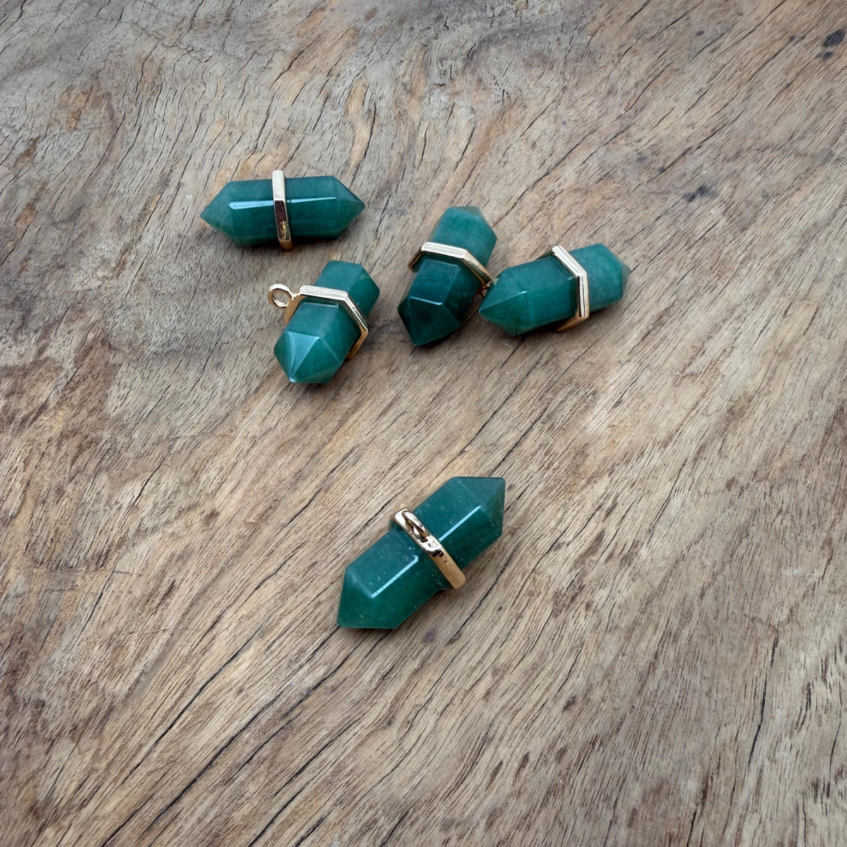 Aventurine double terminated crystal pendant from GemstoneGO, showcasing a natural green gemstone point with polished surfaces.